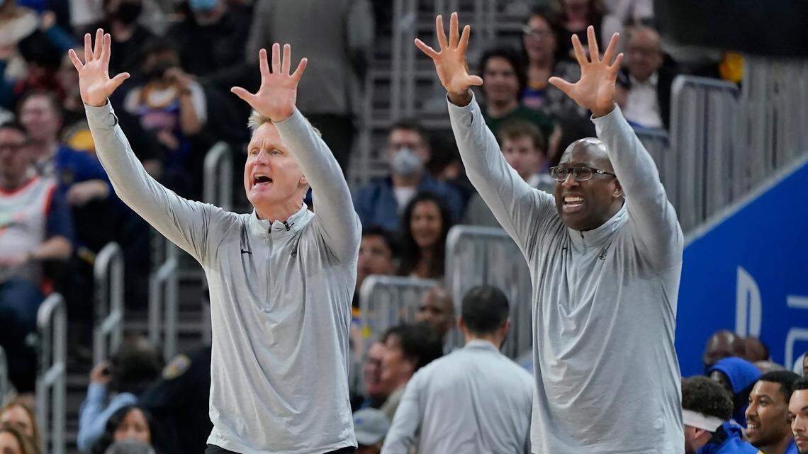 Golden State Warriors coach Steve Kerr, left, and assistant coach Mike Brown gesture to players during the second half of the team’s NBA basketball game against the Boston Celtics in San Francisco, Wednesday, March 16, 2022. (AP Photo/Jeff Chiu)