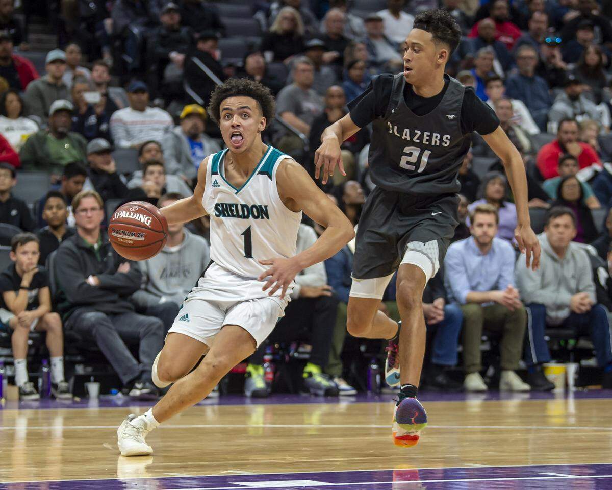 Sheldon High School guard Josh Williams (1) drives to the basket as Huskies play the Sierra Canyon Trailblazers in the CIF Open Division boys basketball state championship at Golden 1 Center on March 9.