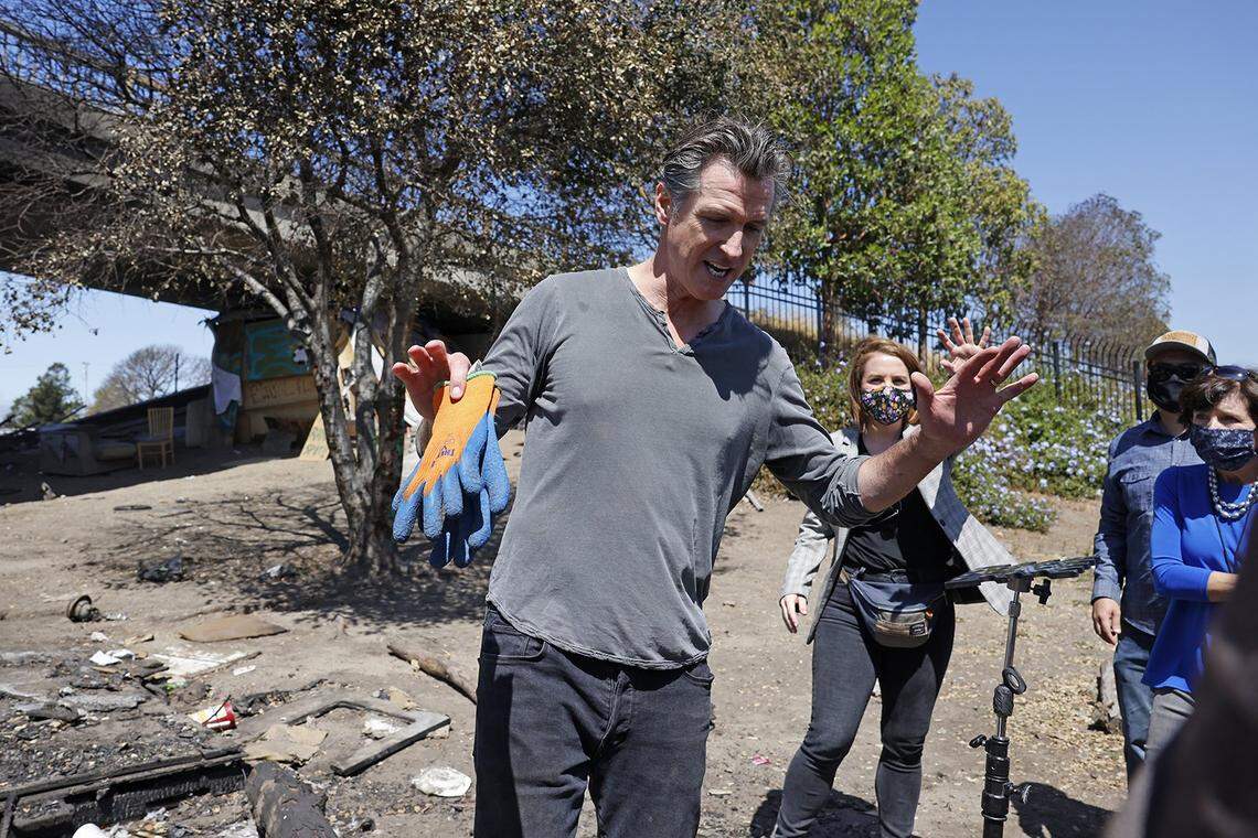 California Gov. Gavin Newsom speaks with media at a long-standing homeless encampment along Highway 80 on Aug. 9, 2021, in Berkeley, California. (John G. Mabanglo/Pool/Getty Images/TNS)