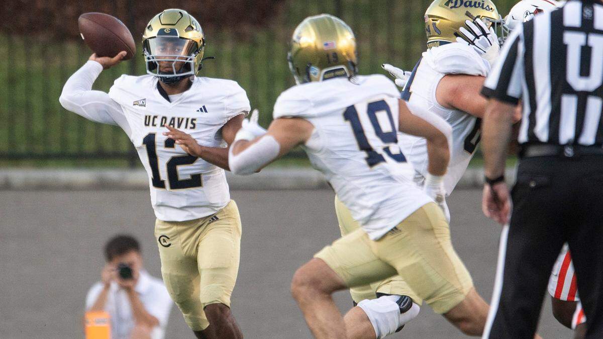 UC Davis quarterback Caden Pinnick, pictured throwing the ball Aug. 23 against the Mercer Bears at the Cramton Bowl in Montgomery, Ala., led a 31-24 comeback win Saturday at Utah Tech after the Aggies trailed 24-7 in the second half.
