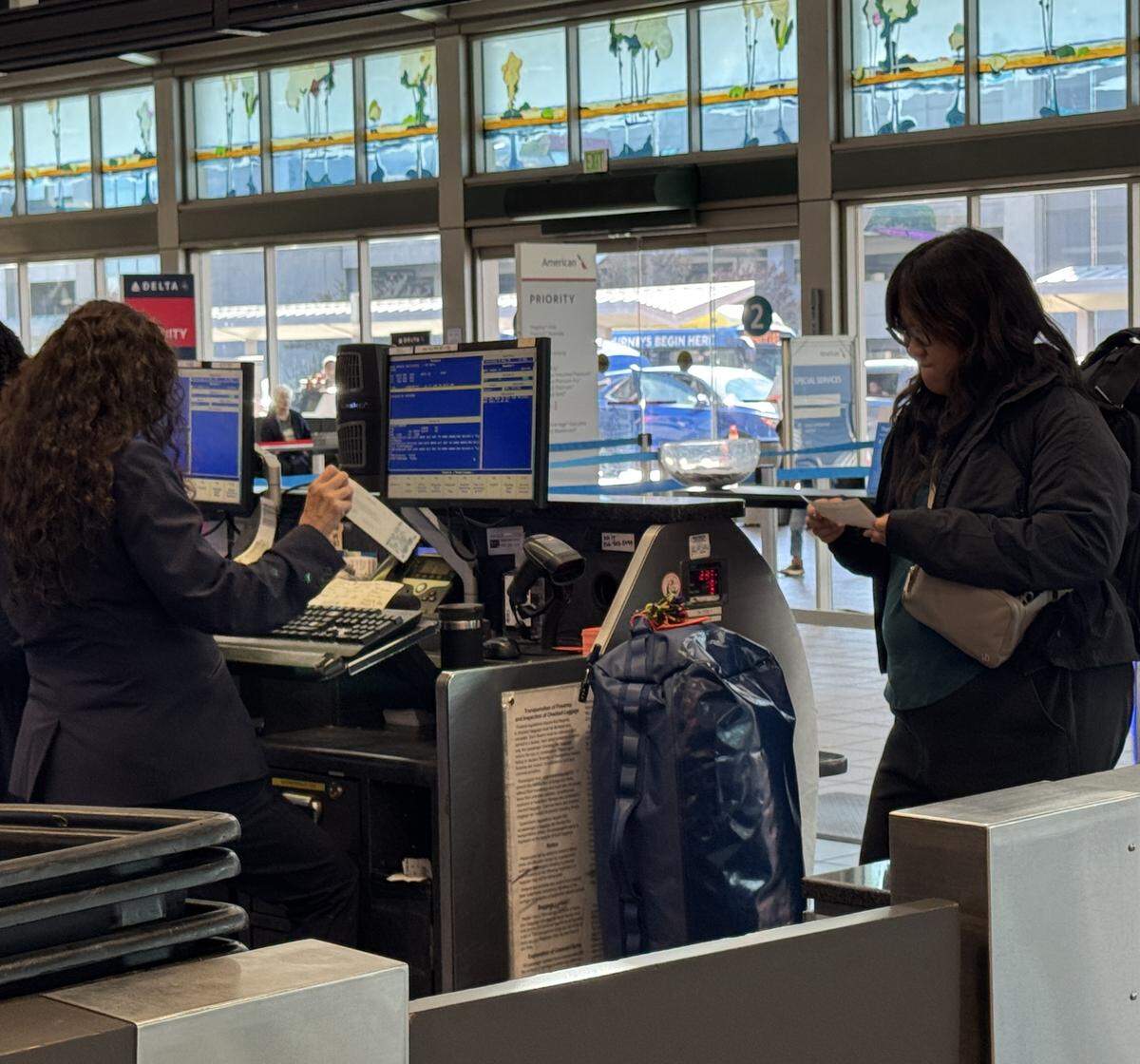Sacramento resident Lauren Fong checks in luggage and reviews her boarding passes at Sacramento International Airport on Saturday.