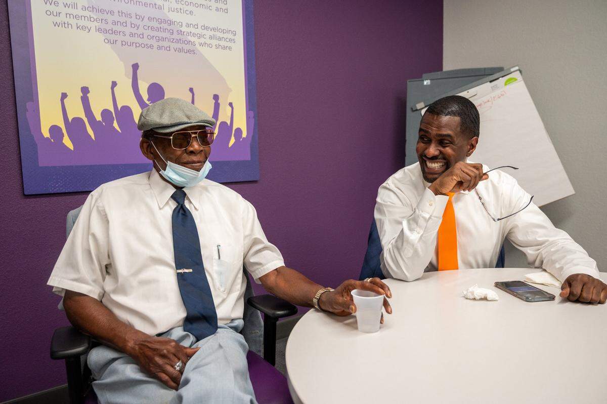Richard Louis Brown, right, sits with his uncle Charlie Louis Brown at the SEIU Local 1000 headquarters in June.