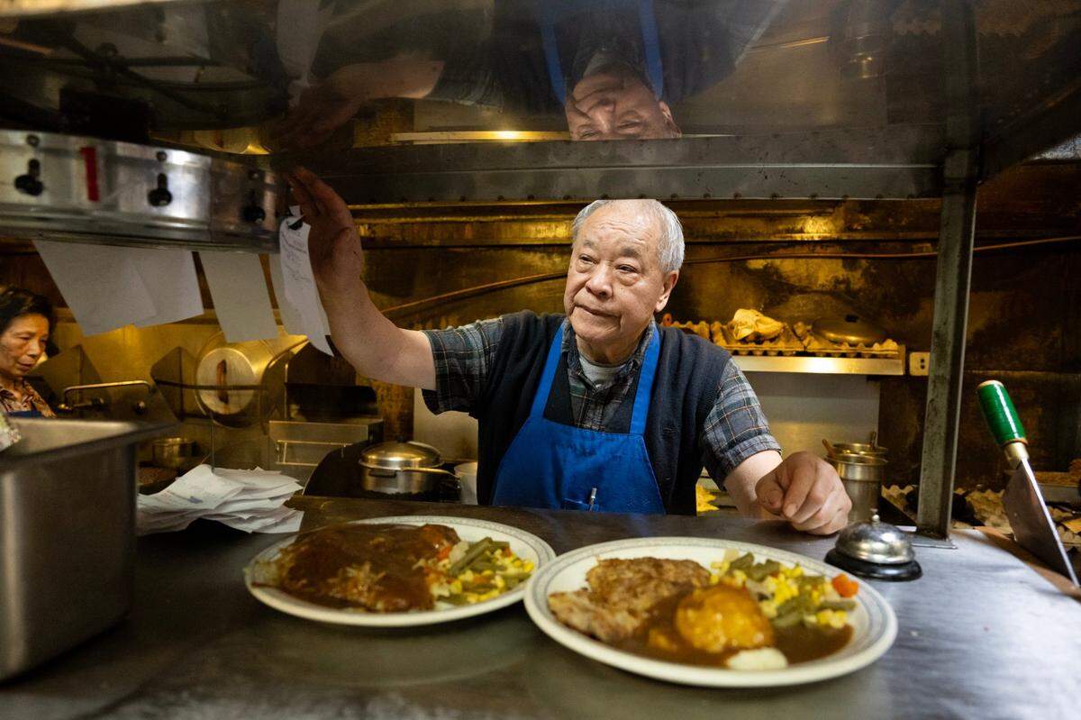 Paul Fong prepares order as his wife, Nancy cooks at their family restaurant, Chicago Cafe, on Friday, Feb. 23, 2024 in Woodland. UC Davis recently confirmed that Chicago Cafe is the oldest Chinese restaurant in California. The restaurant at 411 Main St. is documented to have begun serving customers in 1910, though its origins could stretch back to 1903, as printed on menus.