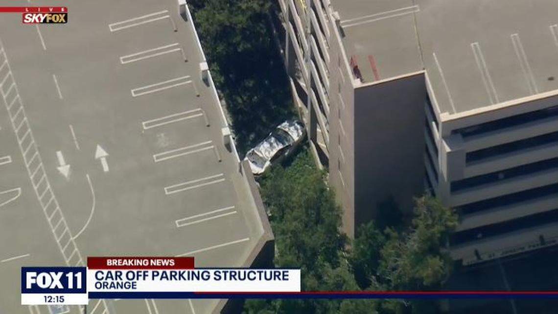 A woman in her 70s died Friday after her car plunged four stories from a hospital parking garage in Orange, California, police said.