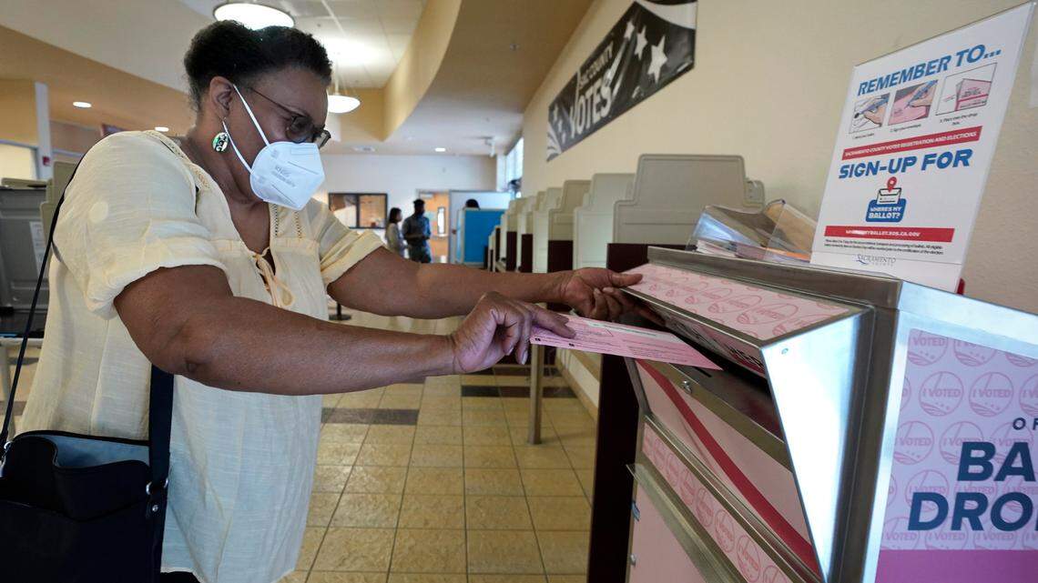 Cheryl Tyler casts her ballot at the Sacramento County Registrar of Voters in Sacramento, Calif., Friday, June 3, 2022. California voters will decide seven statewide initiatives this fall.