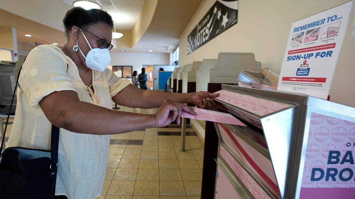 Cheryl Tyler casts her ballot at the Sacramento County Registrar of Voters in Sacramento on Friday. California voters have until Tuesday, June 7, to cast their votes in the California primary to determine which candidates will face off in the general election in November.