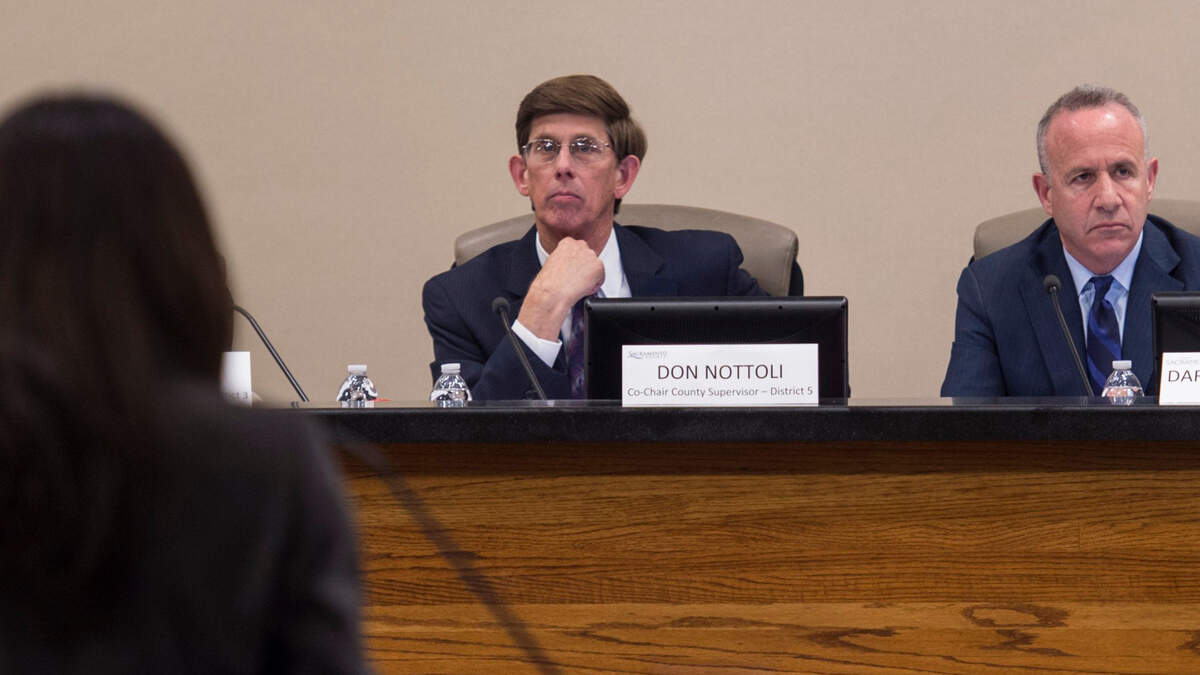Sacramento County Supervisor Don Nottoli listens to a presenter with Sacramento Mayor Darrell Steinberg at a special 2017 joint meeting between the City Council and the Board of Supervisors to tackle homelessness. Nottoli is retiring at the end of his term.