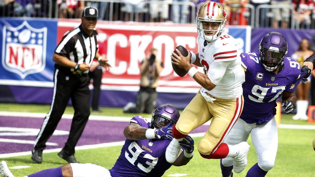 San Francisco 49ers quarterback Jimmy Garoppolo, center, is sacked by Minnesota Vikings defensive tackle Sheldon Richardson (93) and defensive end Everson Griffen (97) on Sunday, Sept. 9, 2018, in Minneapolis.