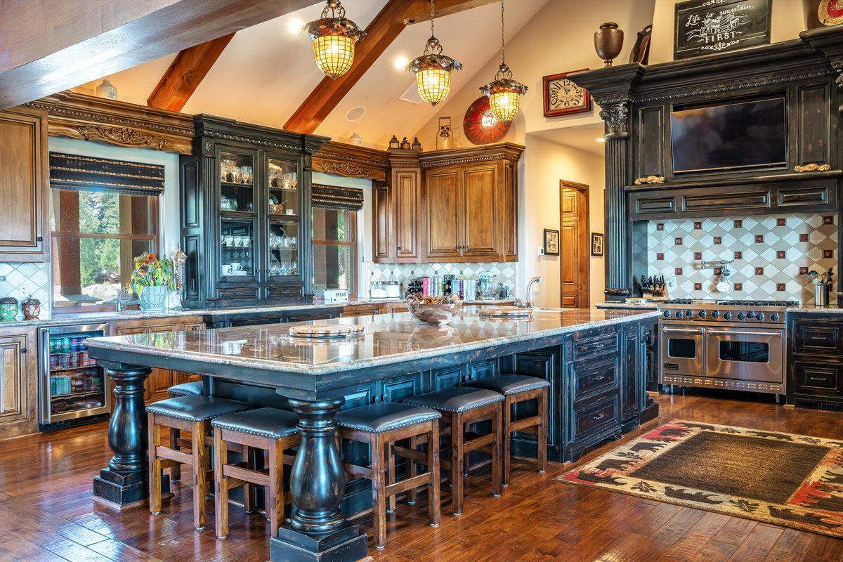 A 7-by-14-foot island, fine craftsmanship and a state-of-the-art appliance suite highlight the kitchen.