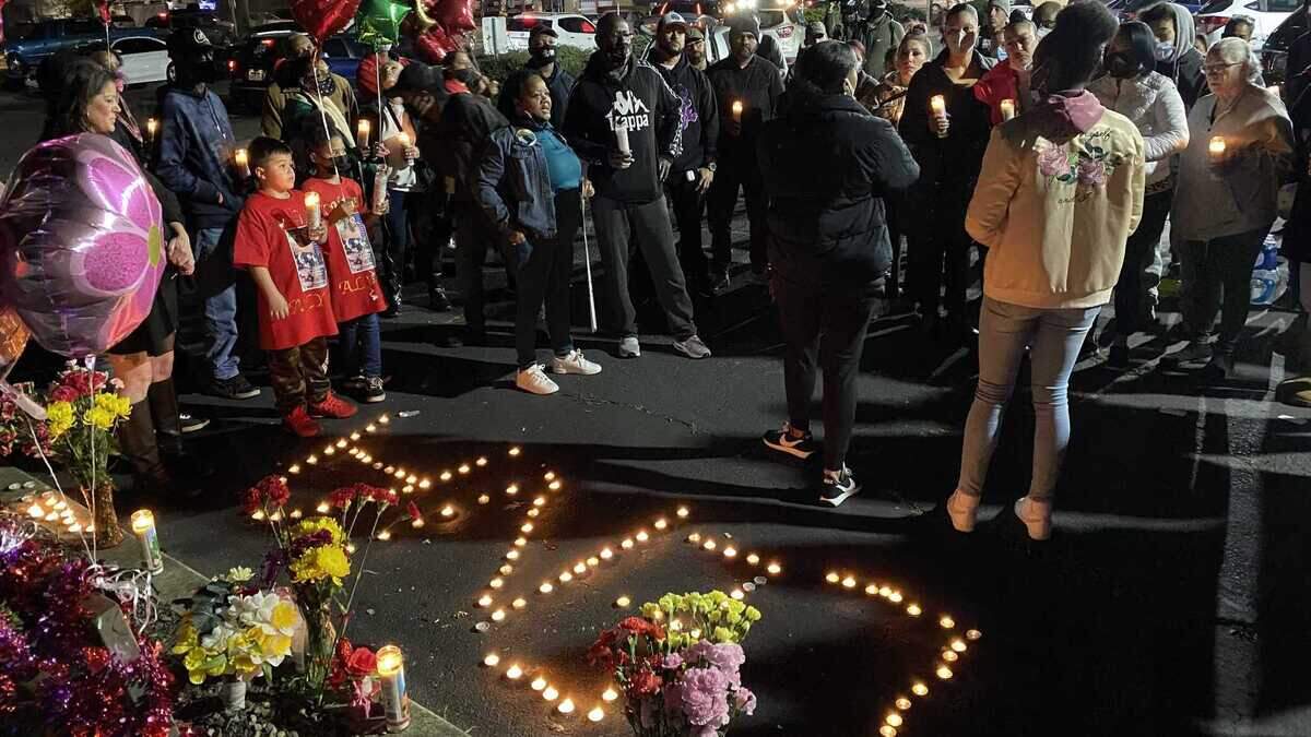 Family and friends gathered Thursday Jan. 20, 2022, at a candlelight vigil for Alynia Asiah Lawrence, who was killed in a shooting on Jan. 13, 2022, while sitting in a car in a parking lot on Stockton Boulevard in Sacramento, California.