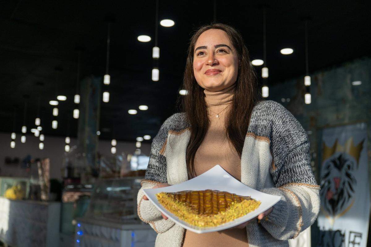 Owner Nour Alchikh Said holds a Dubai chocolate crepe at Nour’s Cafe on Thursday, Feb. 20, 2025, in Carmichael.