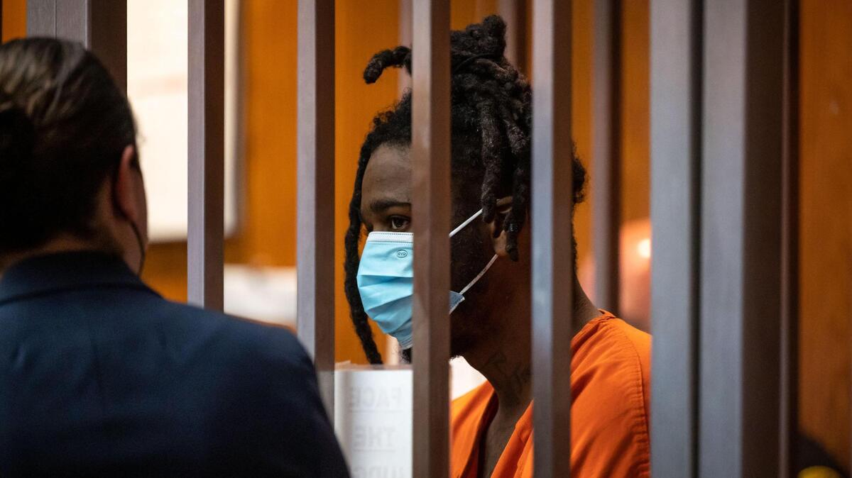 Smiley Martin talks with public defender Meghan Cunningham during his arraignment in Sacramento court Friday, his first court appearance after being injured in the mass shooting in downtown Sacramento on April 3. Authorities say he fired 28 rounds from an automatic handgun in the gang shootout.