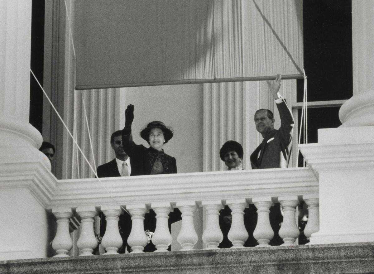 Queen Elizabeth II and Prince Phillip wave to the crowd from the state Capitol in Sacramento during their visit in March 1983.