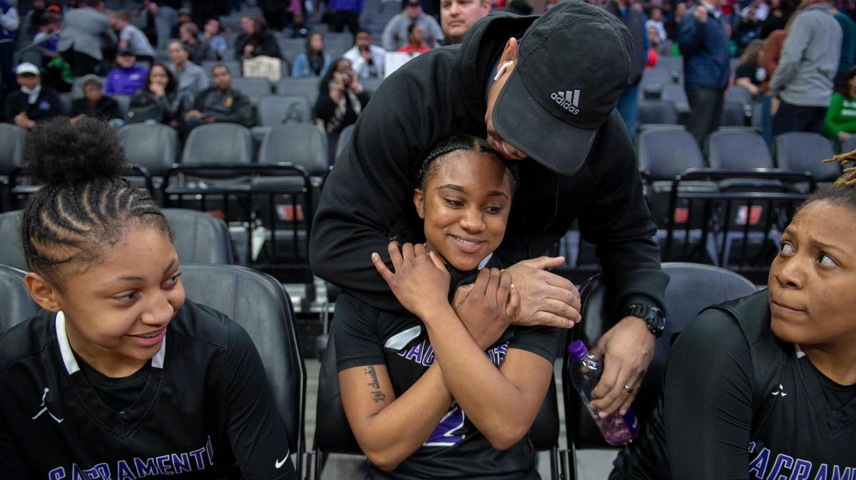 Sacramento High’s Rebekah Brown, middle, is congratulated after making a free throw with .4 seconds left in the game to give the Dragons a one-point victory over Antelope in the Sac-Joaquin Section Division II final Friday night at Golden 1 Center.