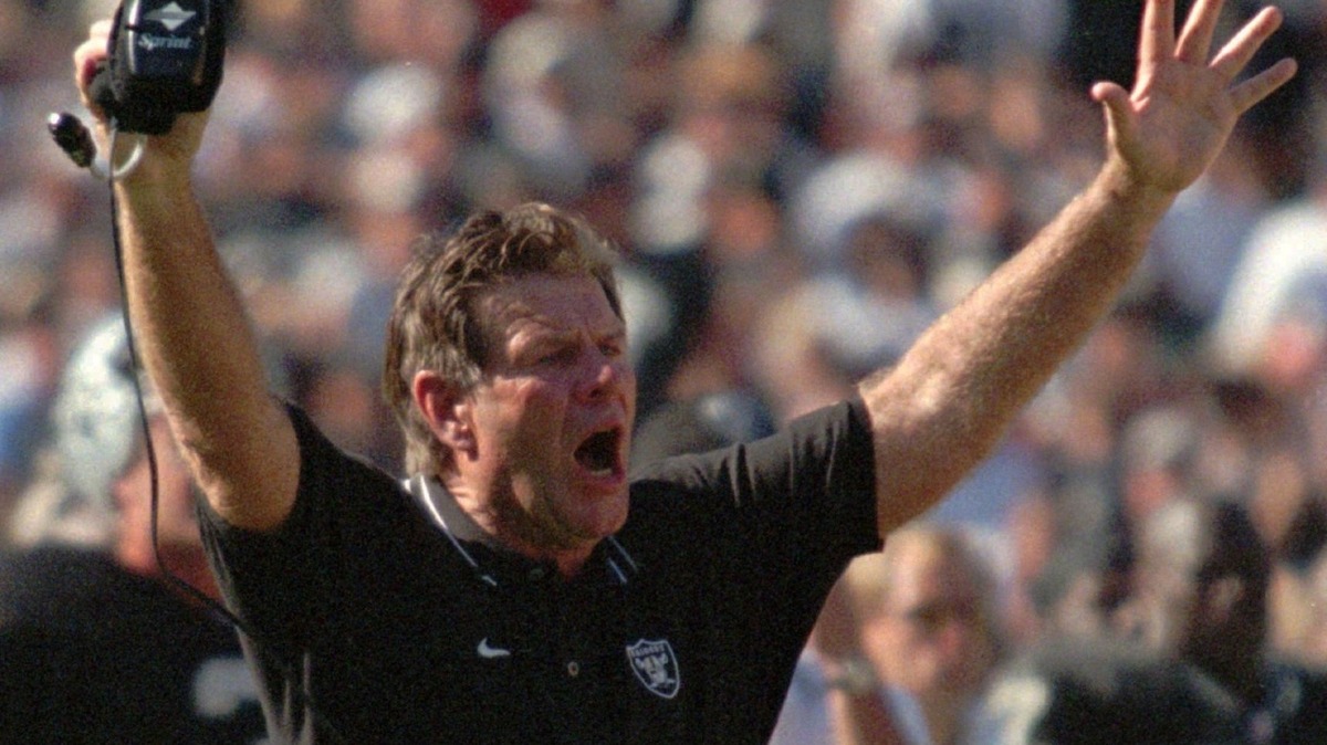 Oakland Raiders coach Joe Bugel raises his hands over his head during a dispute with a referee in the third quarter against the St. Louis Rams on Sunday, Sept. 28, 1997, at the UMAX Coliseum in Oakland, Calif. The Raiders defeated the Rams 35-17. (AP Photo/Ben Margot)