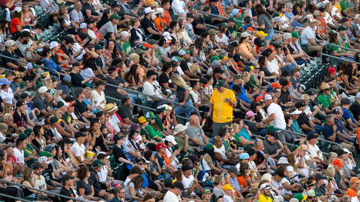 Athletics and San Francisco Giants fans sit in the stands during a baseball game at Sutter Health Park in West Sacramento on Saturday, July 5, 2025.
