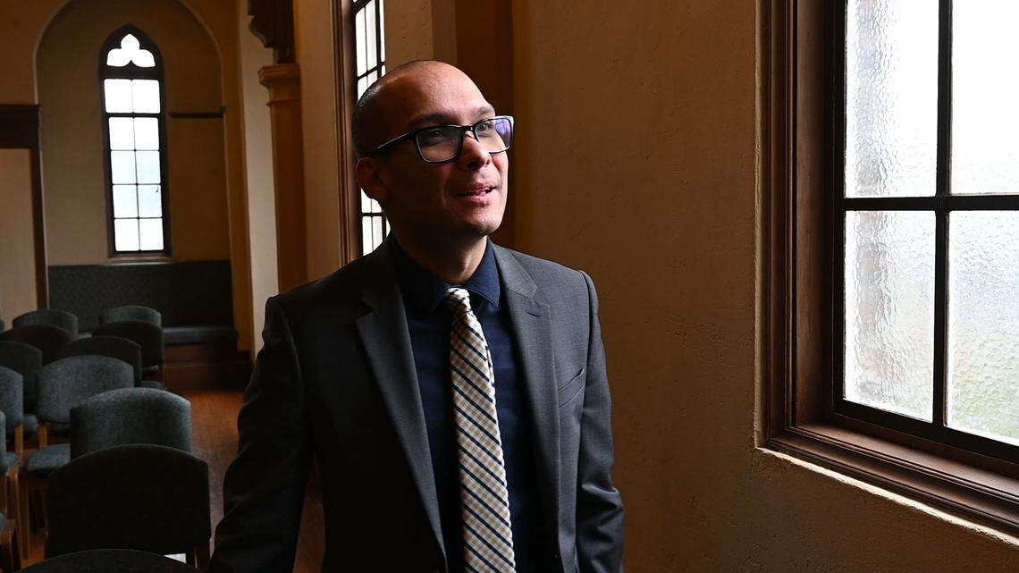 Immigration attorney Kelvin Rosado-Rivera stands in the First Unitarian Universalist Church of Stockton on the day he spoke to the congregation of Iglesia Luterana Santa María Peregrina, which uses the church for services, about their rights if they are approached by federal immigration officials.