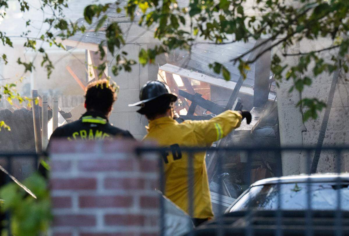 Sacramento firefighters respond to an explosion and fire that destroyed a home on 39th Street in Oak Park on Thursday, Aug. 21, 2025. One person was killed in the incident.