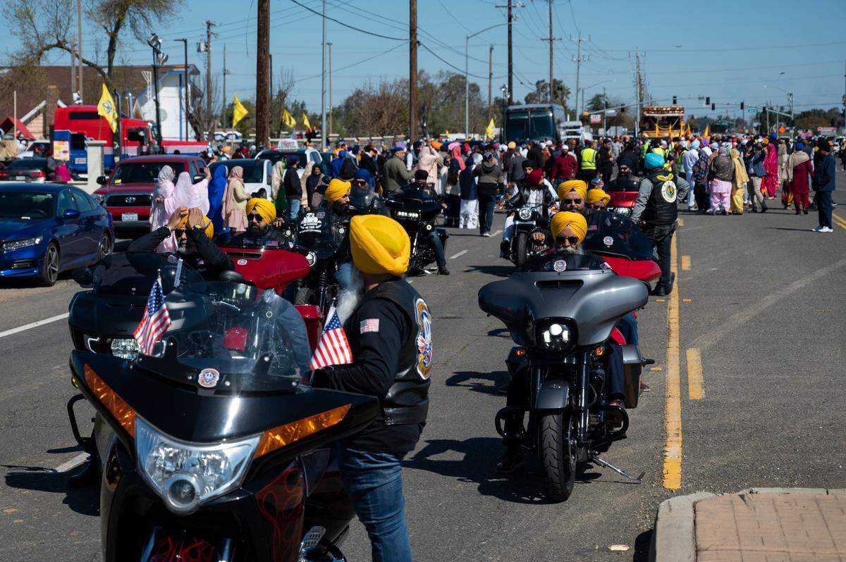 The Sikh Legends of America wait on motorcycles to start the the Sacramento Sikh Society’s first Nagar Kirtan parade on Sunday, March 26, 2023, at the Sacramento Sikh Society Temple in Vineyard.