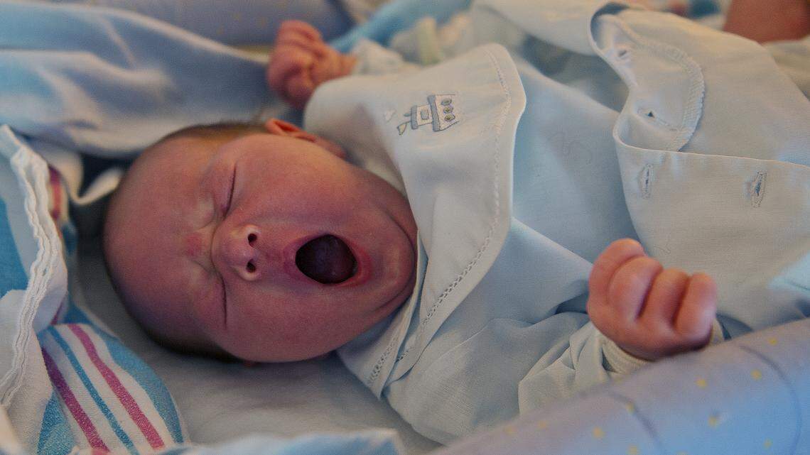 Seven day old Ivan Alexander Cooper yawns on his changing table at home in Fair Oaks. His mother Simone Morin was hoping to have natural childbirth at their home but he wound up being delivered at the hospital by his dad Dr. Daniel Cooper.