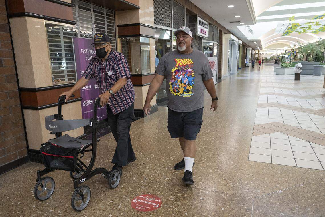 Paul Walker, left, and Vernon Dozier walk laps at Sunrise Mall in Citrus Heights on Sept. 16. Walker has been walking at the mall five days a week for more than 20 years.