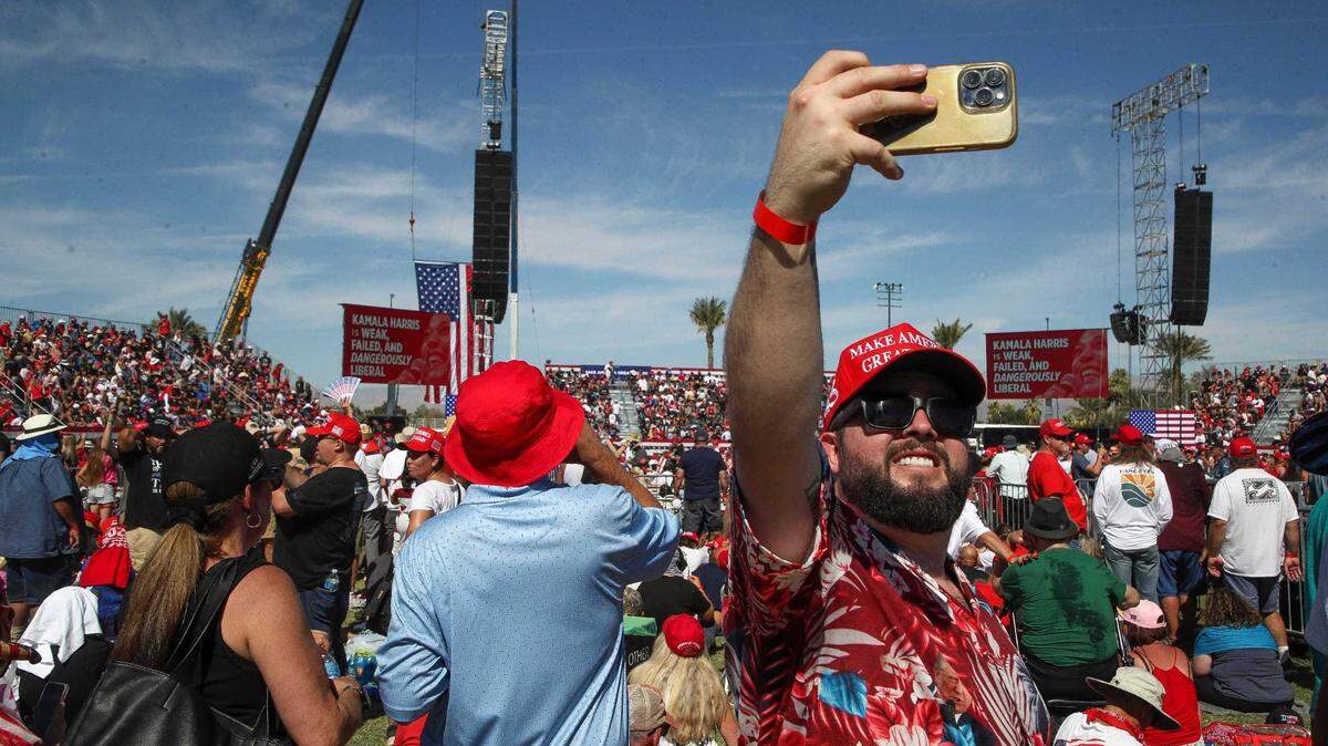 Trump supporter Angel Salazar takes a selfie while attending Saturday’s rally in Coachella. Thousands of Donald Trump supporters braved afternoon temperatures that briefly nudged 100 degrees, crowding into one of the sparsely shaded polo fields where the famous Coachella and Stagecoach music festivals are held.