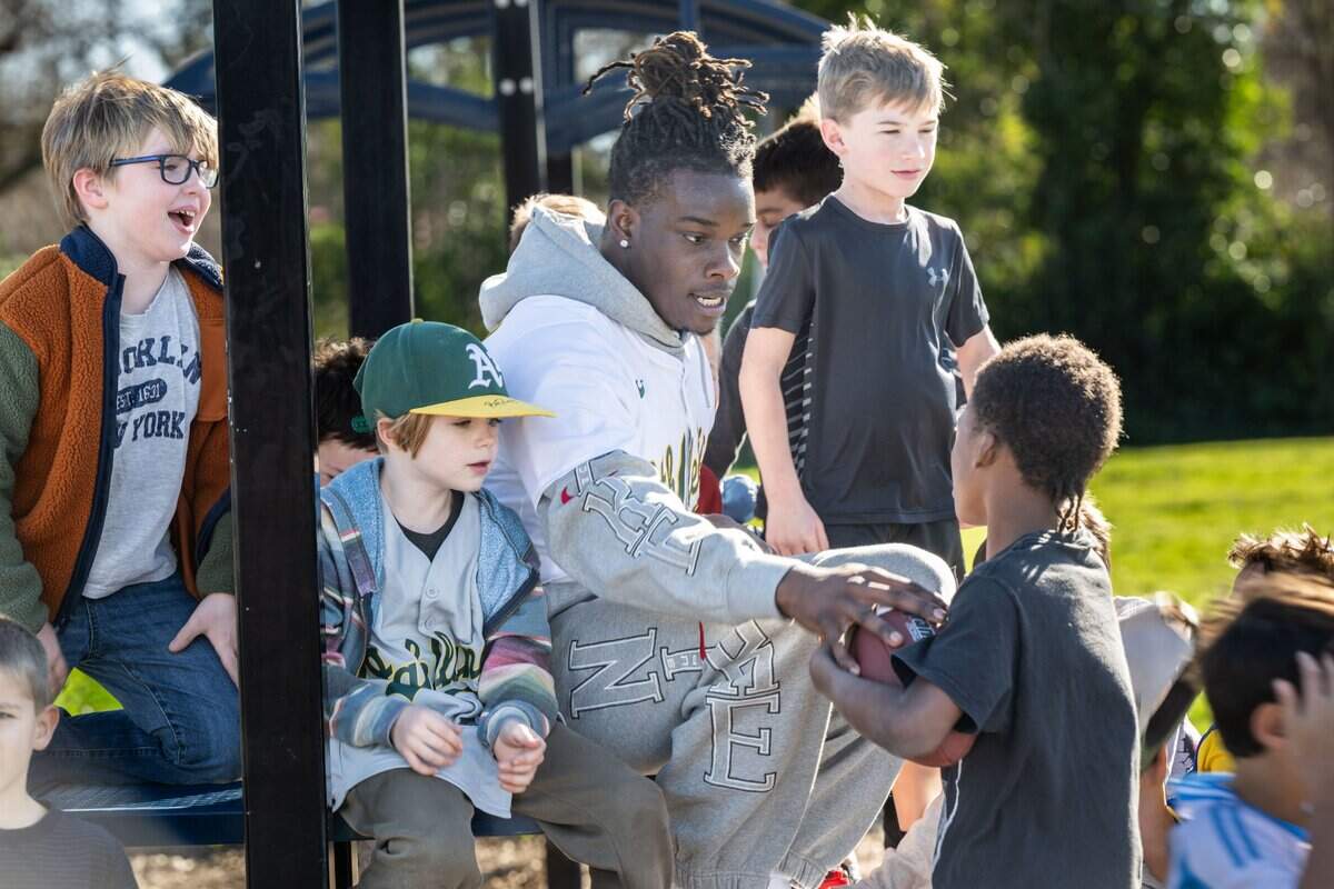 Athletics outfielder Lawrence Butler talks with students during a “recess takeover” at Mariemont Elementary School in Arden Arcade on Tuesday.