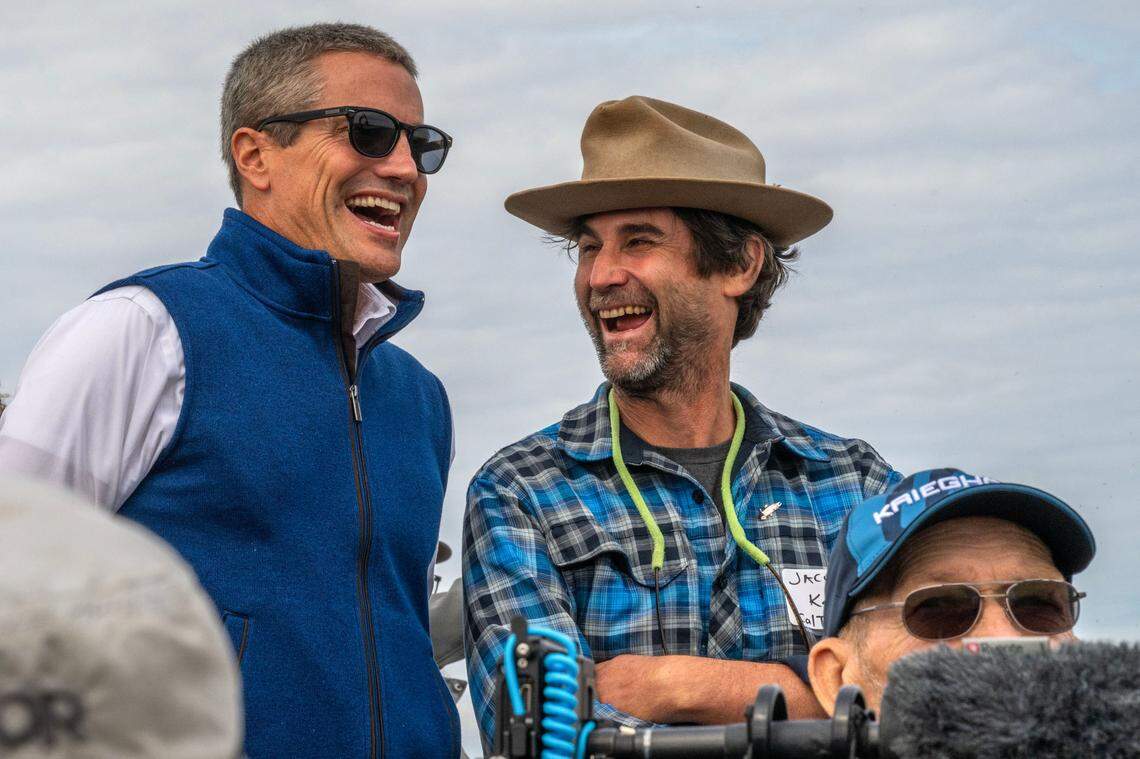 California Natural Resource Agency Secretary Wade Crowfoot, left, and Save California Salmon’s Jacob Katz, right, share a moment during a levee breaching ceremony at Lookout Slough on Wednesday, Sept. 18, 2024.