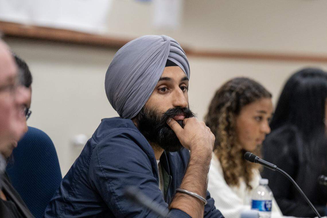 Board President Jasjit Singh looks on after a parent handed him a notice of intention to circulate a recall petition against the East Sacramento trustee at the Sacramento City Unified School District board meeting on Thursday.