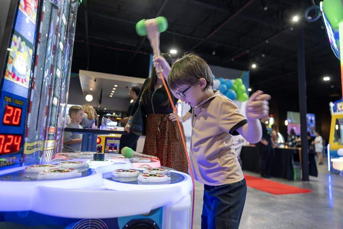Yannai Salomon, 7, hammers down on a target on a game at the BLVD in West Sacramento on Wednesday, Aug. 6, 2025.
