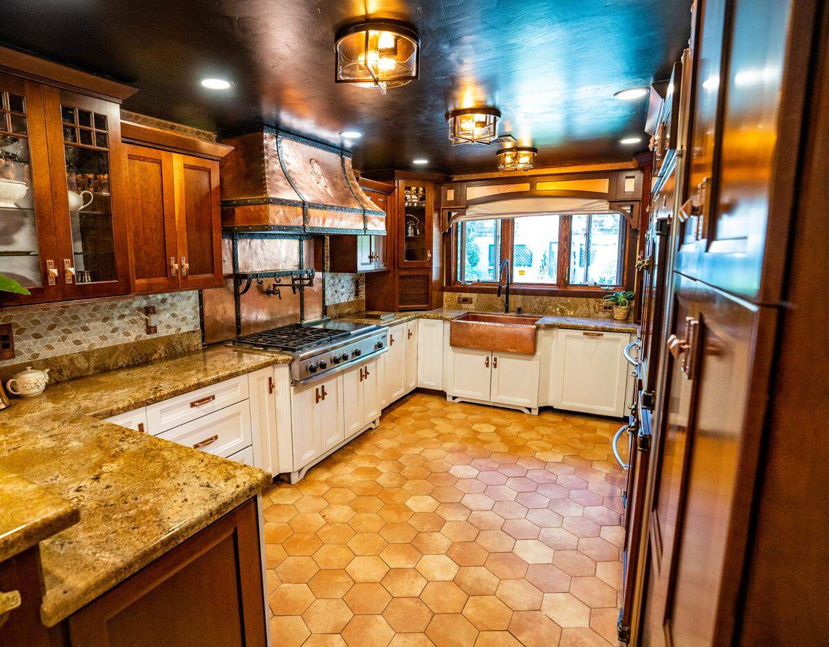 The kitchen of the Saverien Manor is filled nearly top to bottom with a custom brass finish, October 26, 2022.