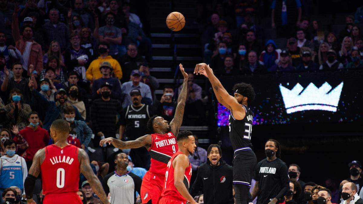 Sacramento Kings forward Marvin Bagley III (35) shots over Portland Trail Blazers forward Nassir Little (9) and scores a three point basket in the fourth quarter during a game at the Golden 1 Center on Wednesday, November 24, 2021, in Sacramento.