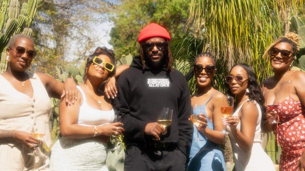 D’Aramis Byrd, centered, holds a glass of wine with friends during the first Eden Natty Wine Garden. The next event at Estate Farms is from 3 to 8 p.m. Sunday.