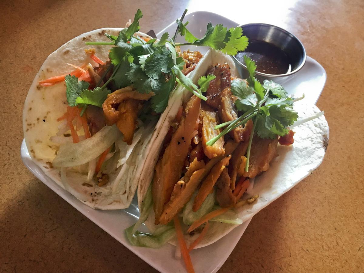 “Vietnamese tacos,” with chicken in plain flour tortillas and a roundup of vegetables is among the menu items at Saigon Street Eat.