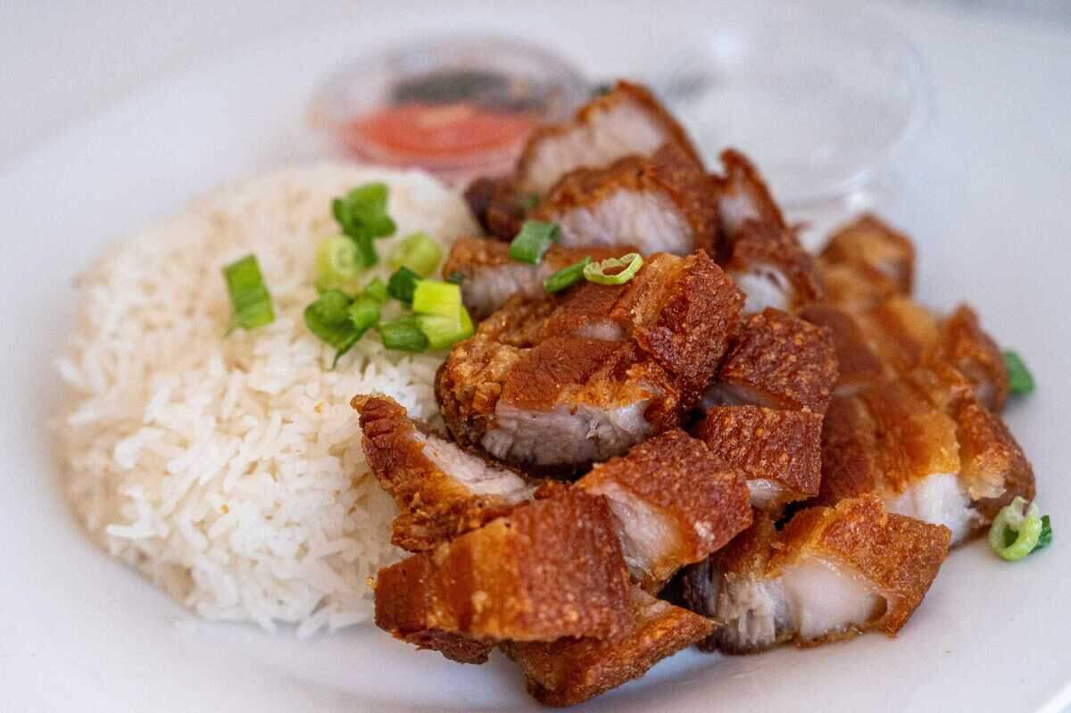 Lechon kawali rice plates are available at Spoon and Fork in Sacramento on July 17. Lechon kawali is deep fried, marinated pork belly.