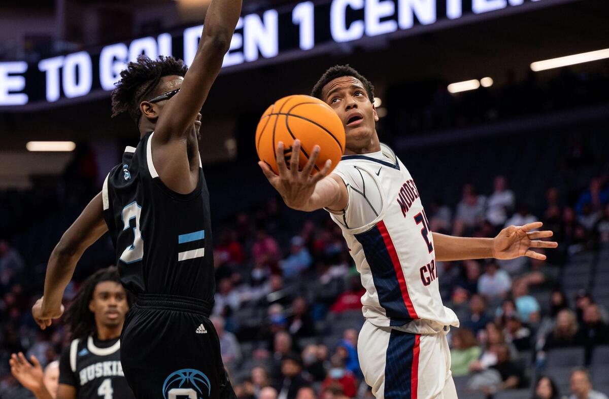 Modesto Christian Crusaders’ Jamari Phillips (24), right, tries to put a shot in under Sheldon Huskies’ Marcellus Franklin (3), but is blocked, during the second period of the high school boys basketball Sac-Joaquin Section Division I championship game Saturday, Feb. 26, 2022, at Golden 1 Center in Sacramento. Modesto Christian beat Sheldon, 52-42, for the title.