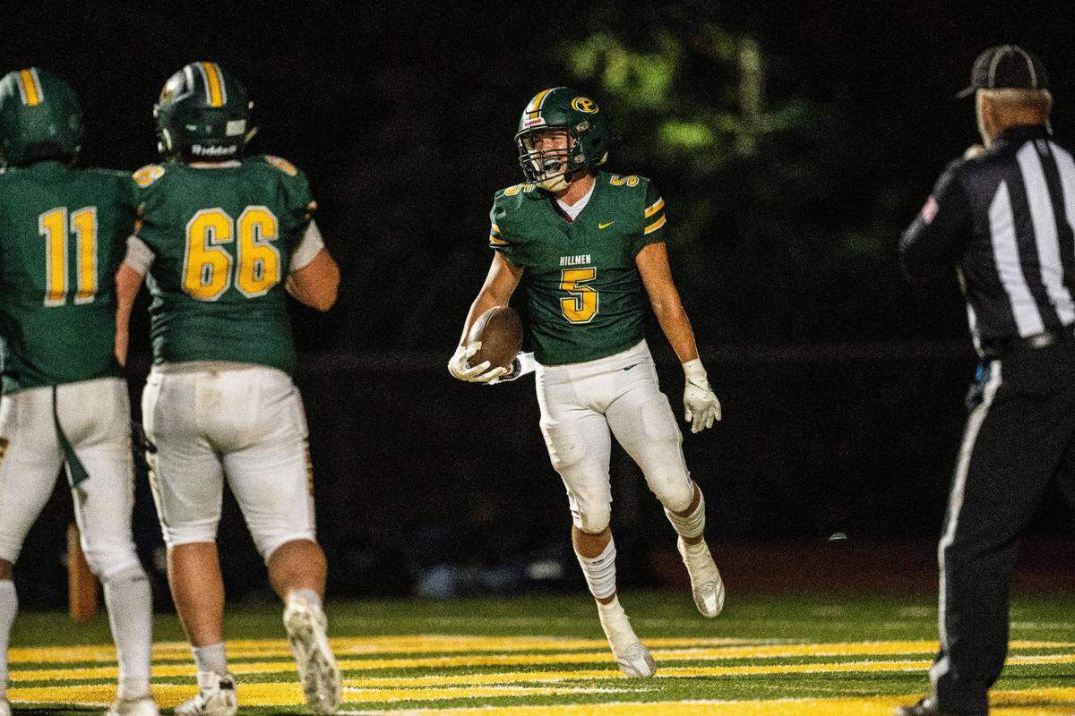 The Placer Hillmen’s Shaun Jones (5) celebrates a two-point conversion against the Casa Roble Rams in August. 