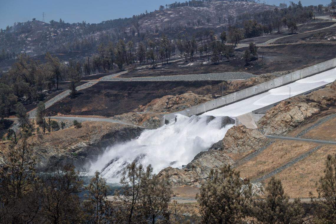 Scorched earth is shown Wednesday near the Oroville Dam spillway after the Thompson Fire burned 3,000 acres and the city declared a state of emergency.