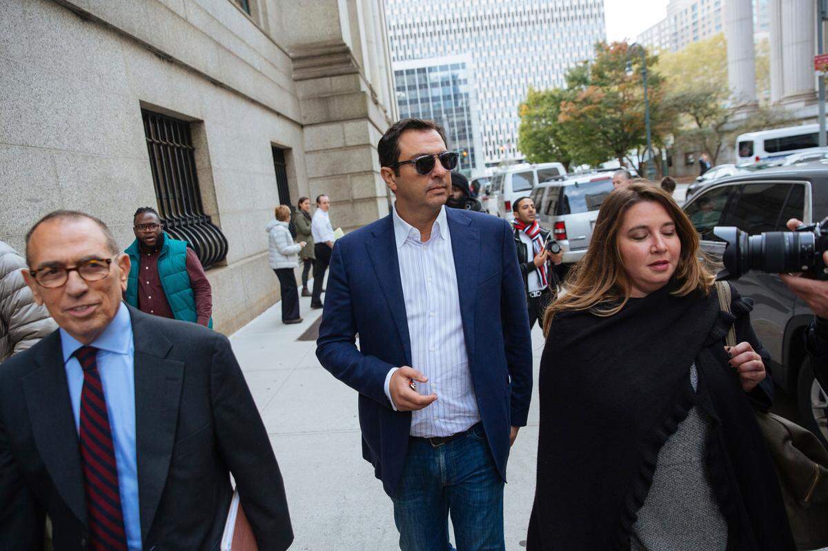 Andrey Kukushkin, center, an investor in Sacramento’s cannabis industry, leaves the federal courthouse in New York after pleading innocent to charges of conspiring with associates of Rudy Giuliani, President Donald Trump’s lawyer, to use foreign money to make illegal campaign contributions.