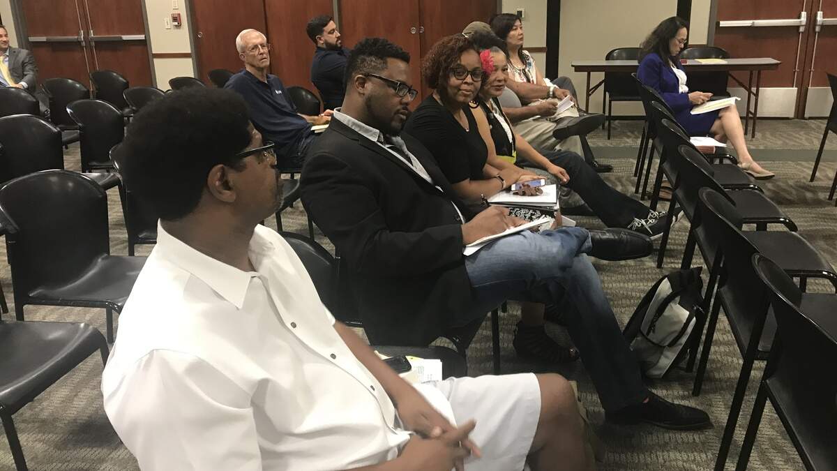 From left: Derrell Roberts, Pastor Chris Logan, Lorreen Pryor and Allegra Taylor wait to address the Sacramento City Unified school board.