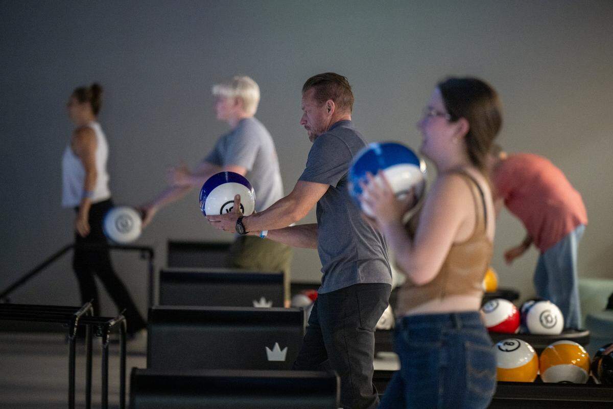 Aaron Provencal, center, makes his approach to one of the twenty lanes at the bowling center at the BLVD in West Sacramento on Wednesday, Aug. 6, 2025.