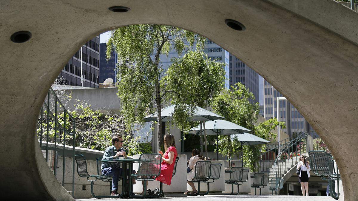People have lunch at the Embarcadero Center in 2016 in San Francisco. A proposal to ban employee cafeterias at new San Francisco office buildings is being considered by city leaders.