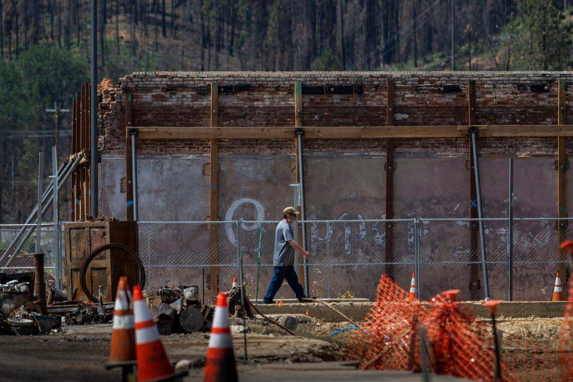 A pedestrian walks in front of what used to be the Way Station Cocktails and Dining on Thursday in downtown Greenville.