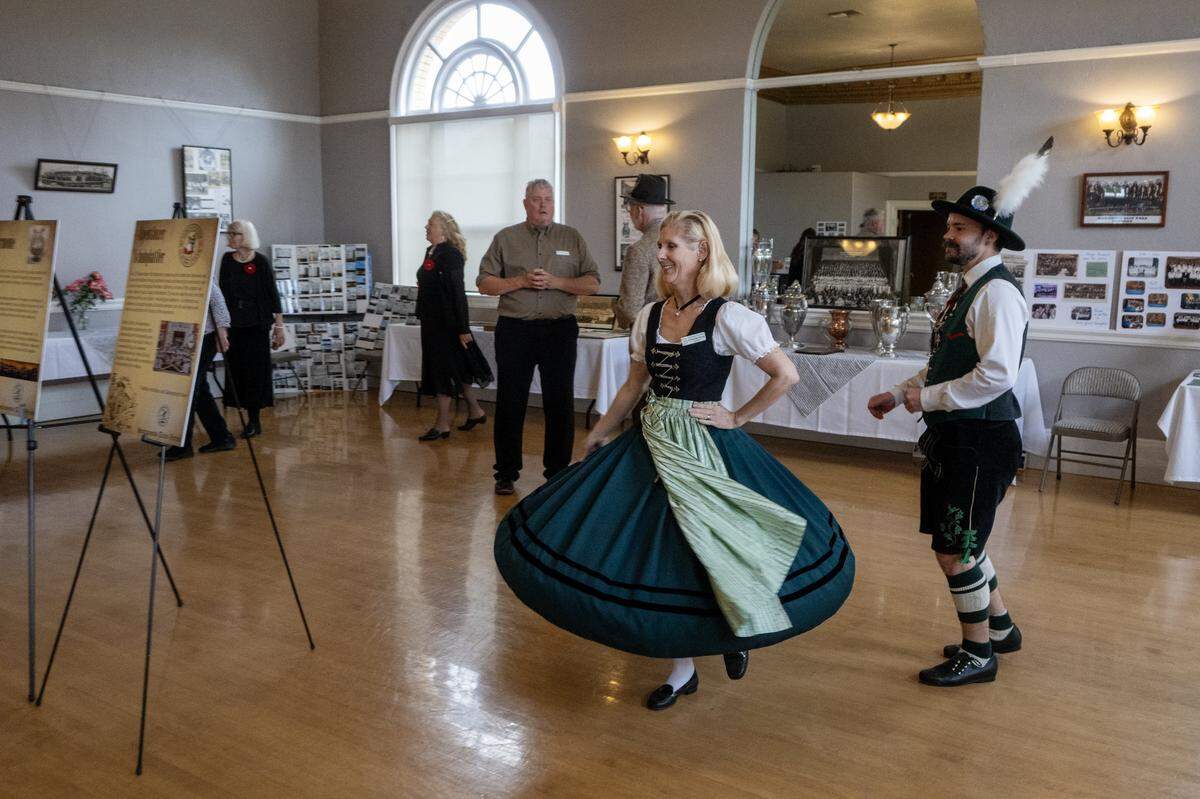 Kimberlee Cheng and Matthew Cooley participate in a traditional Austrian dance at an open house celebrating 100 years of Turner Hall, the home of Sacramento Turn Verein, on April 25.