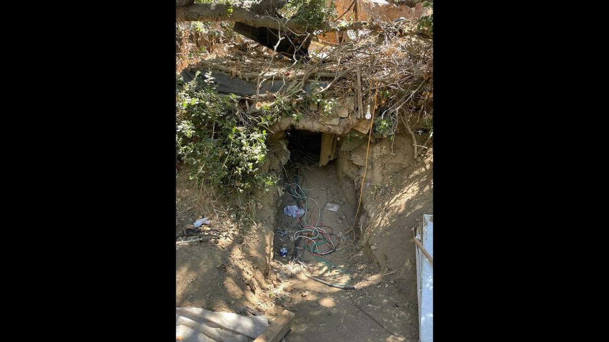 Officers following up on a commercial burglary found a makeshift underground bunker full of stolen property at a San Jose homeless camp, California police say.
