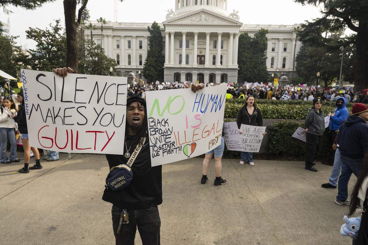 Trevon Younger, of Sacramento, joins a student-led protest against ICE at the state Capitol on Friday. “The high school kids are out here for a future that may not be here if we’re not doing this,” he said.
