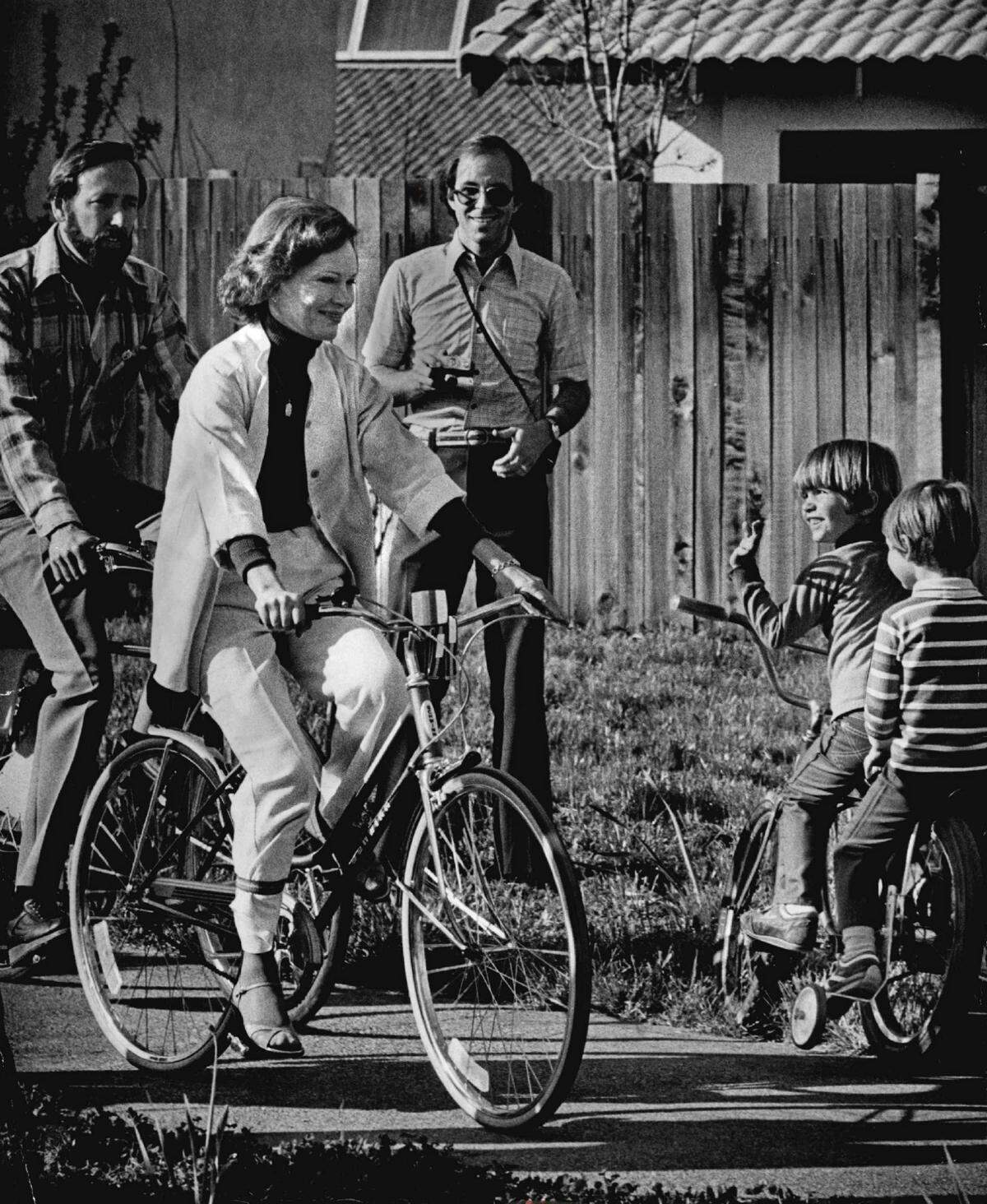 First Lady Rosalynn Carter is greeted by fellow cyclists in Davis during her visit to the city on March 21, 1979, to promote its energy-conserving solar homes and bicycle paths. She kissed children at almost every stop, according to news reports.
