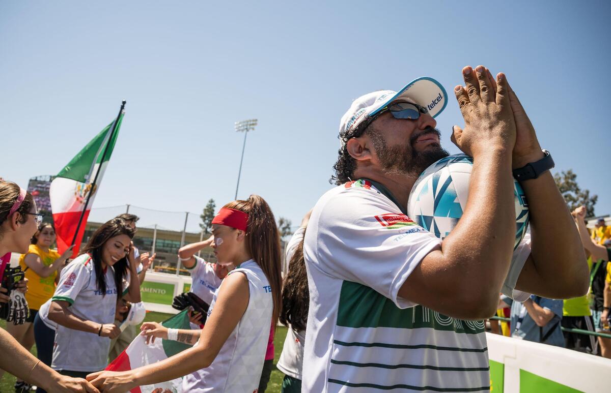 Mexico women’s team coaches and players celebrate after their win over Chile for the championship at the Homeless World Cup on Saturday, July 15, 2023, at Sacramento State’s Hornet Stadium.