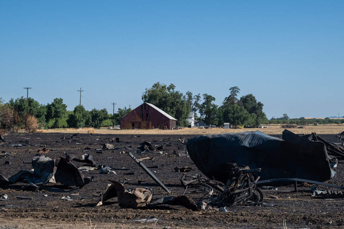Debris from the Esparto fireworks explosion rests in a field across County Road 23 from the pyrotechnics facility on Friday, July 18, 2025, the first day the evacuation order and area road closures were lifted.