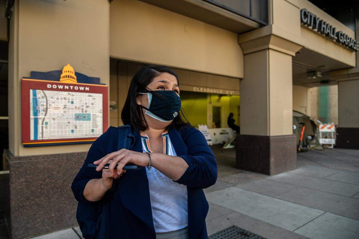 Sacramento Councilmember Katie Valenzuela reacts to the structure damage at City Hall Garage from a van fire that was allowed safe parking for homeless by the city on Friday, March 26, 2021. The garage has been closed since Saturday March 20.